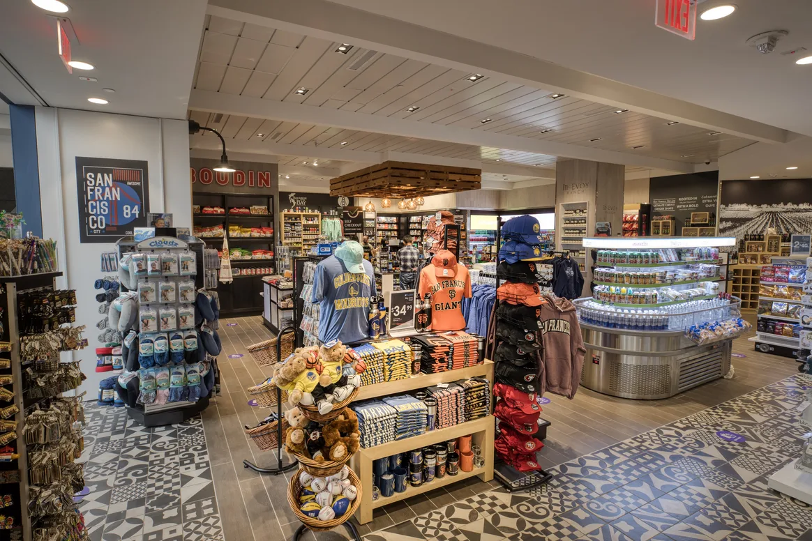 Interior view of 49 Mile Market showing retails stands with souvenirs and t-shirts