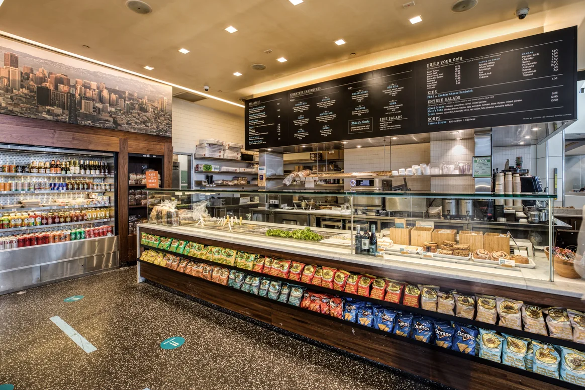 Menu board, drinks, and snack case at Klein's Deli, Terminal 3, SFO
