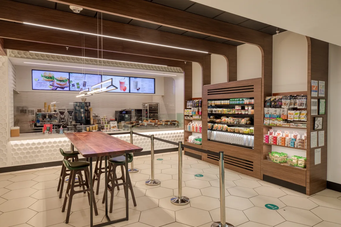 Interior seating area and product shelves at Green Beans Coffee, SFO
